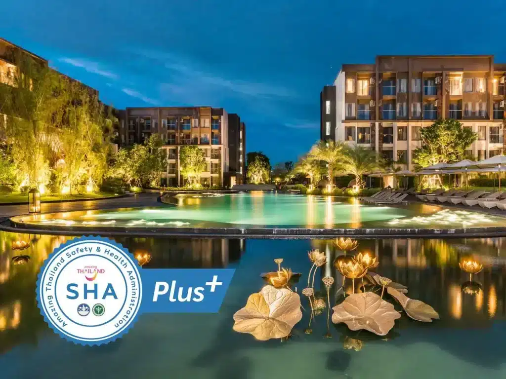 A luxurious resort at dusk with an illuminated swimming pool surrounded by lush greenery that evokes the natural attractions in Bangkok. Gold lotus flower sculptures adorn the water. The resort buildings glow warmly in the background. The "SHA Plus+" certification logo is prominently displayed in the bottom left corner.