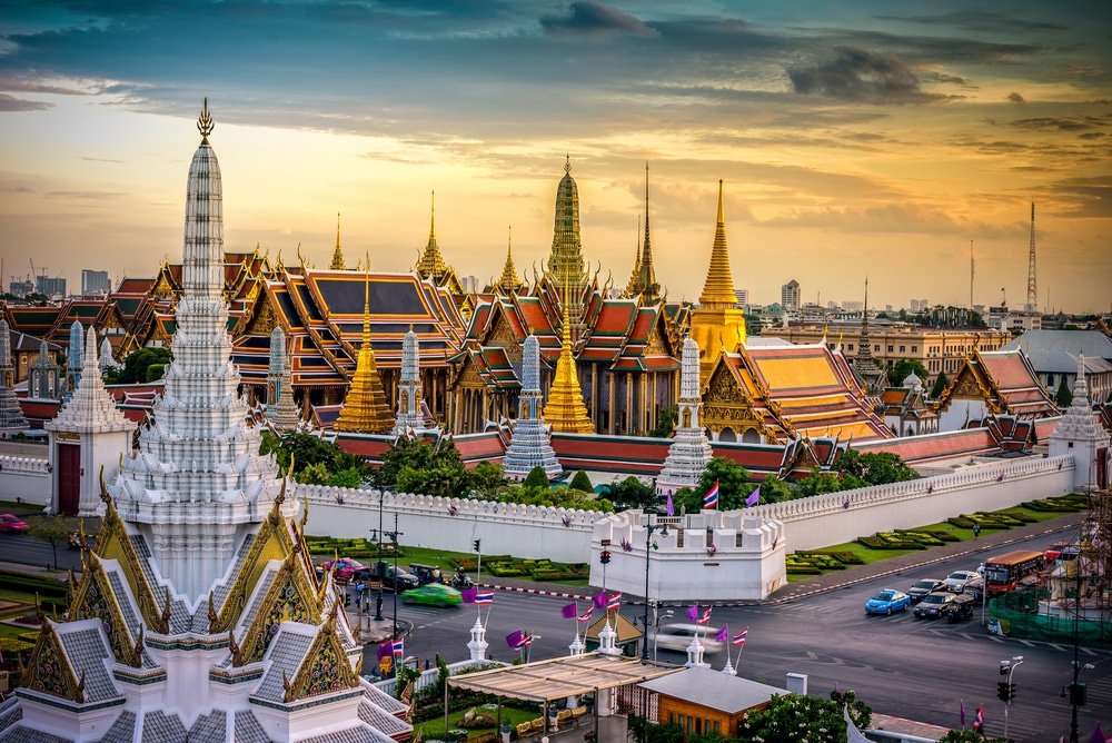 a large building with many spires and a street